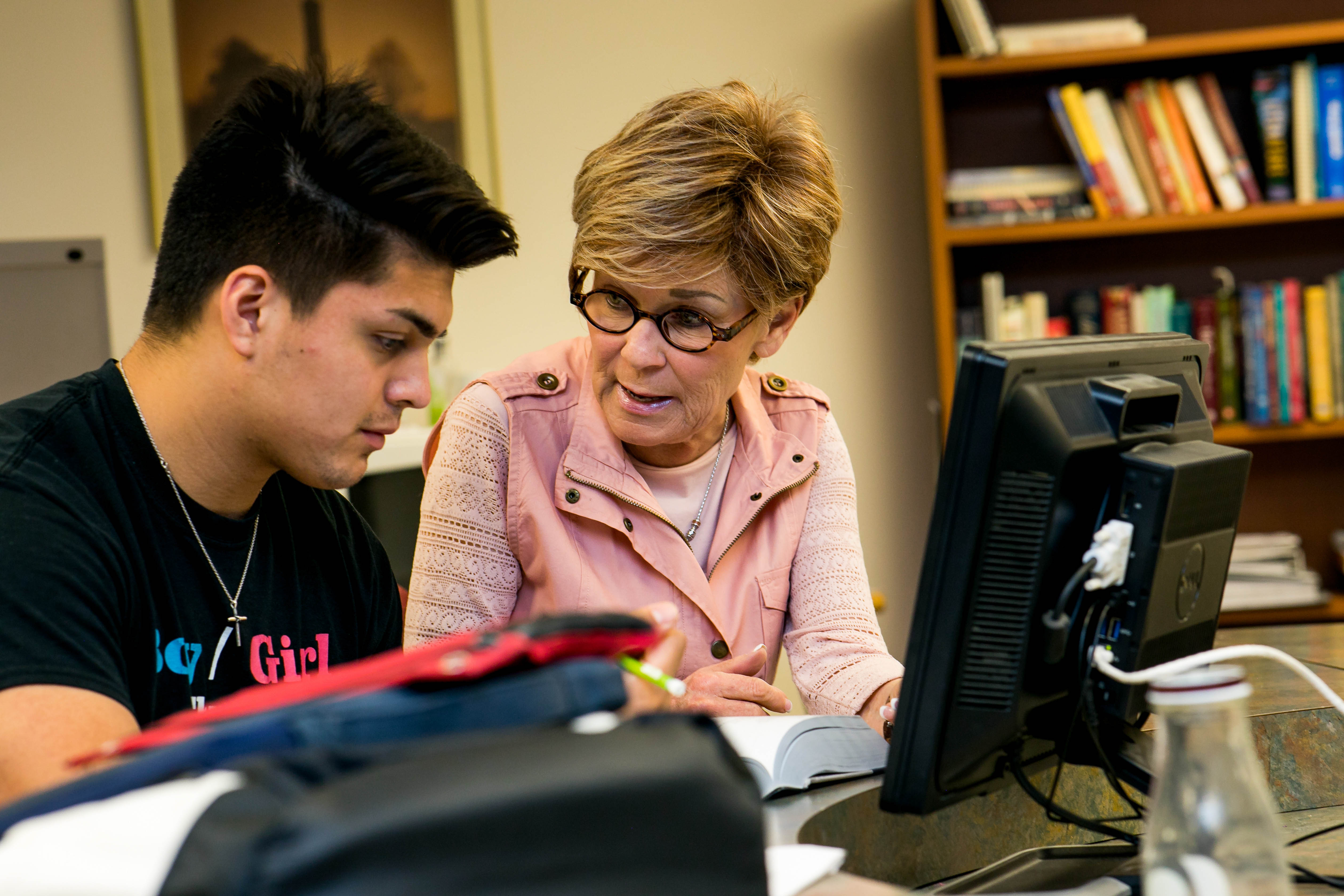 Academic resources staff working with a student.