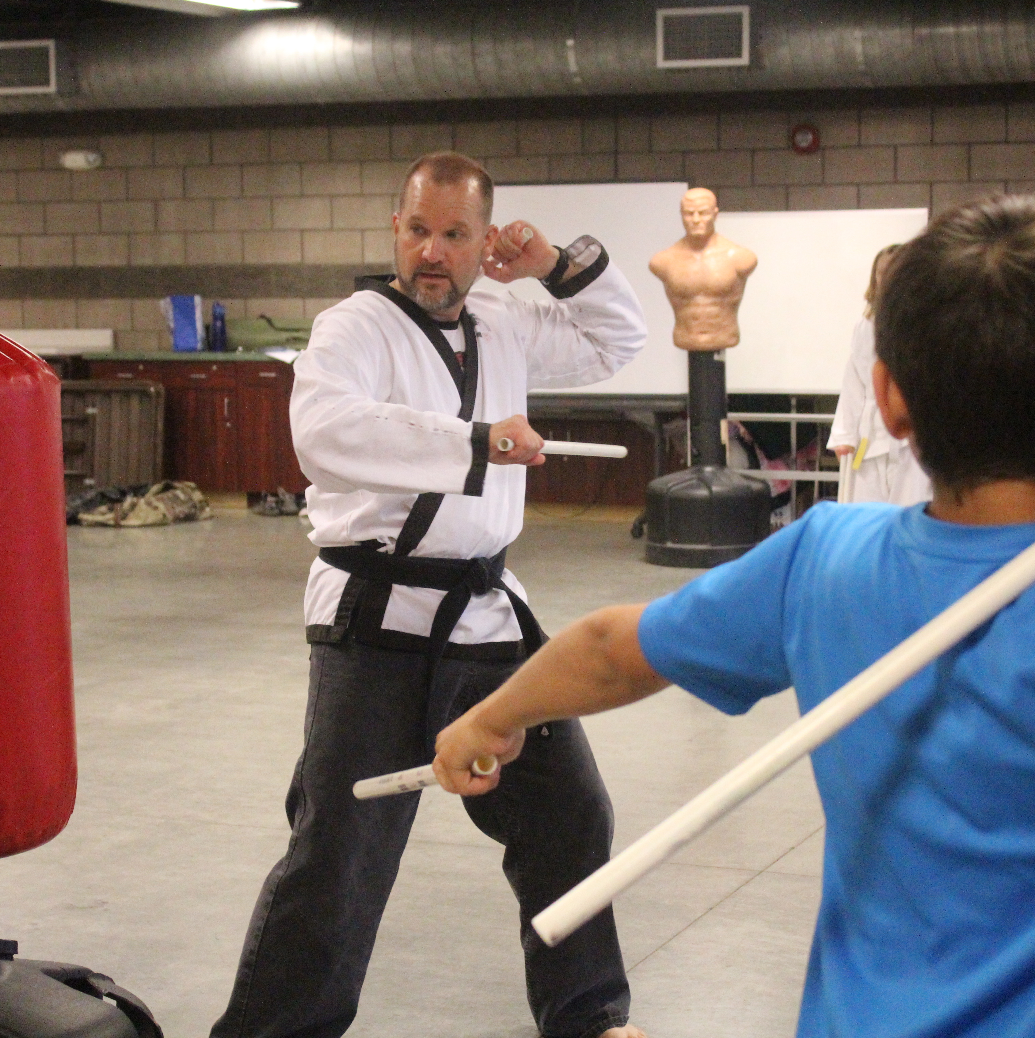 Local youth training with a martial arts instructor. 