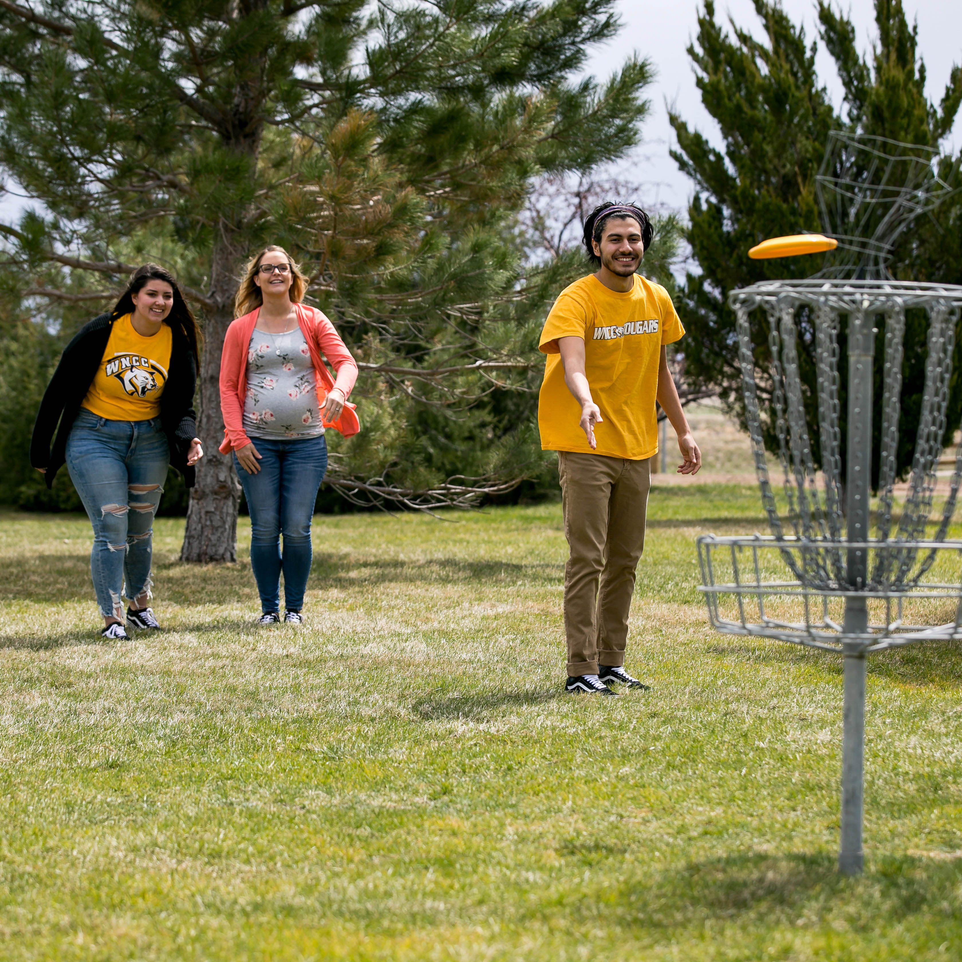 wncc sidney students playing disc golf